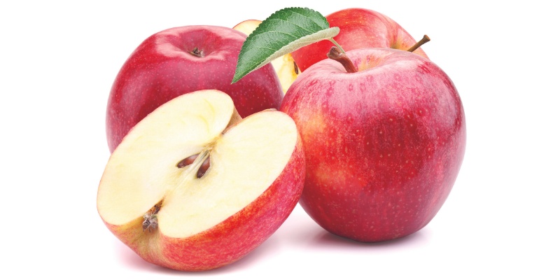 Rdeča jabolka na beli podlagi